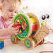 Hape Walk-A-Long Snail Shape Sorter Pullalong Girl Playing