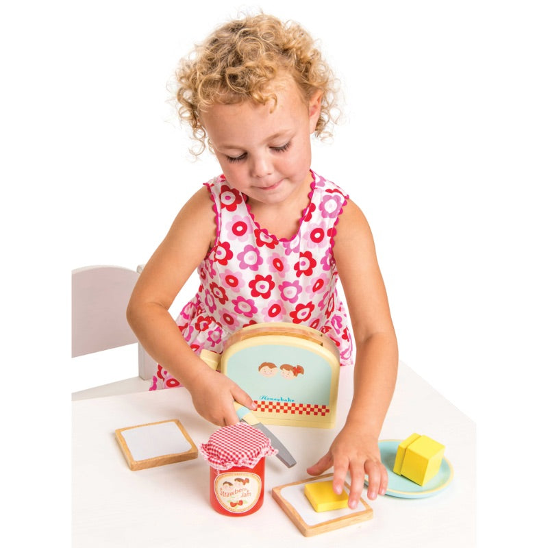 Le Toy Van Honeybake Toaster Set Girl buttering Bread