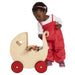 Moover Dolls Pram Natural with Red Wheels Girl Playing