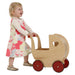 Moover Dolls Pram Natural with Red Wheels Girl Pushing