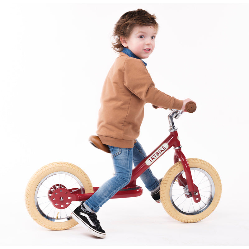 Trybike Red Vintage Trybike with Cream Tyres Boy Riding